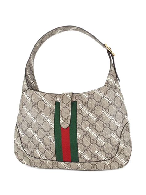 is balenciaga owned by gucci.